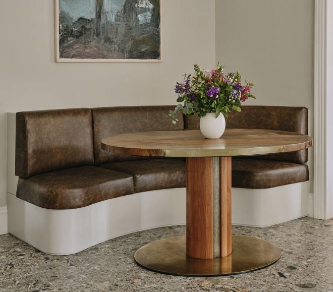 Banquette seat in the new forest kitchen made from wood and upholstered in leather. Along with a  bespoke walnut table 