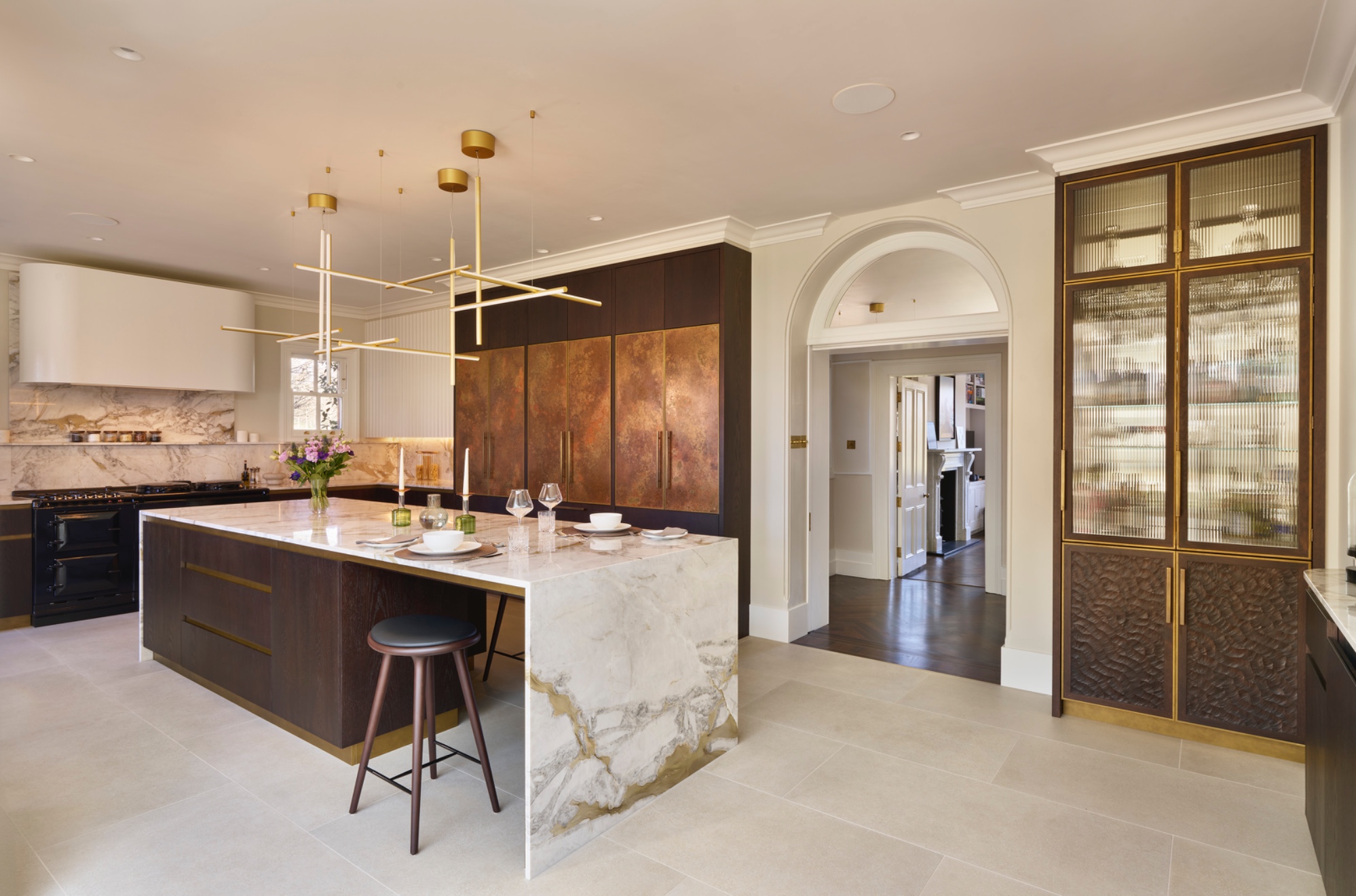 Sevenoaks Kitchen in copper and dark stained oak with a marble book matched island