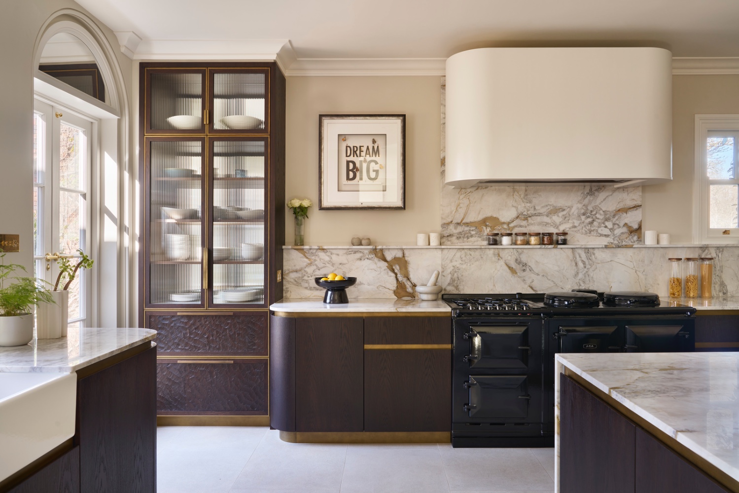 Dark stained oaks cabinets and black cooker in the Sevenoaks Kitchen