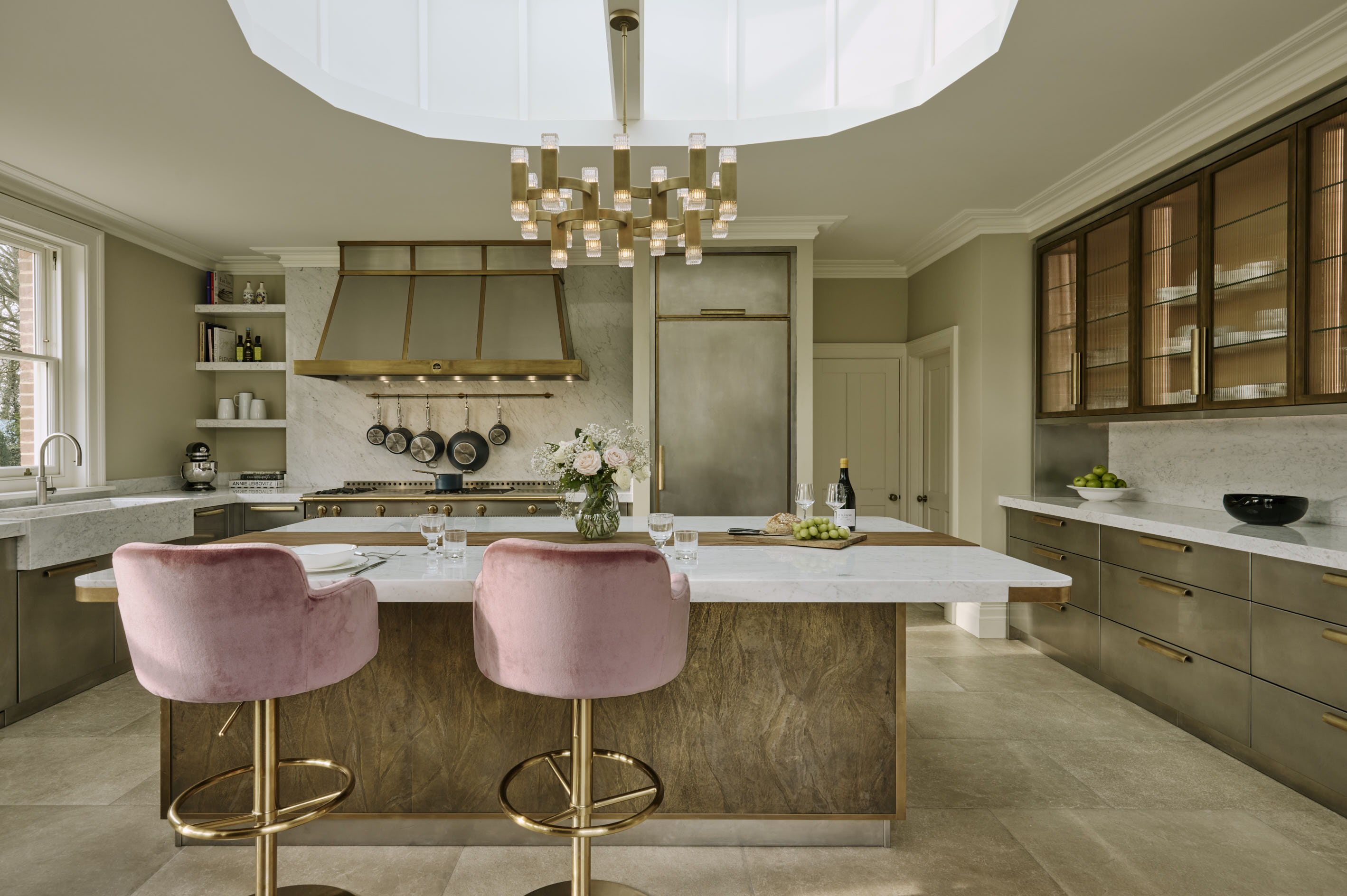 The Oxford Kitchen in stainless steel featuring inlaid brass to add warmth