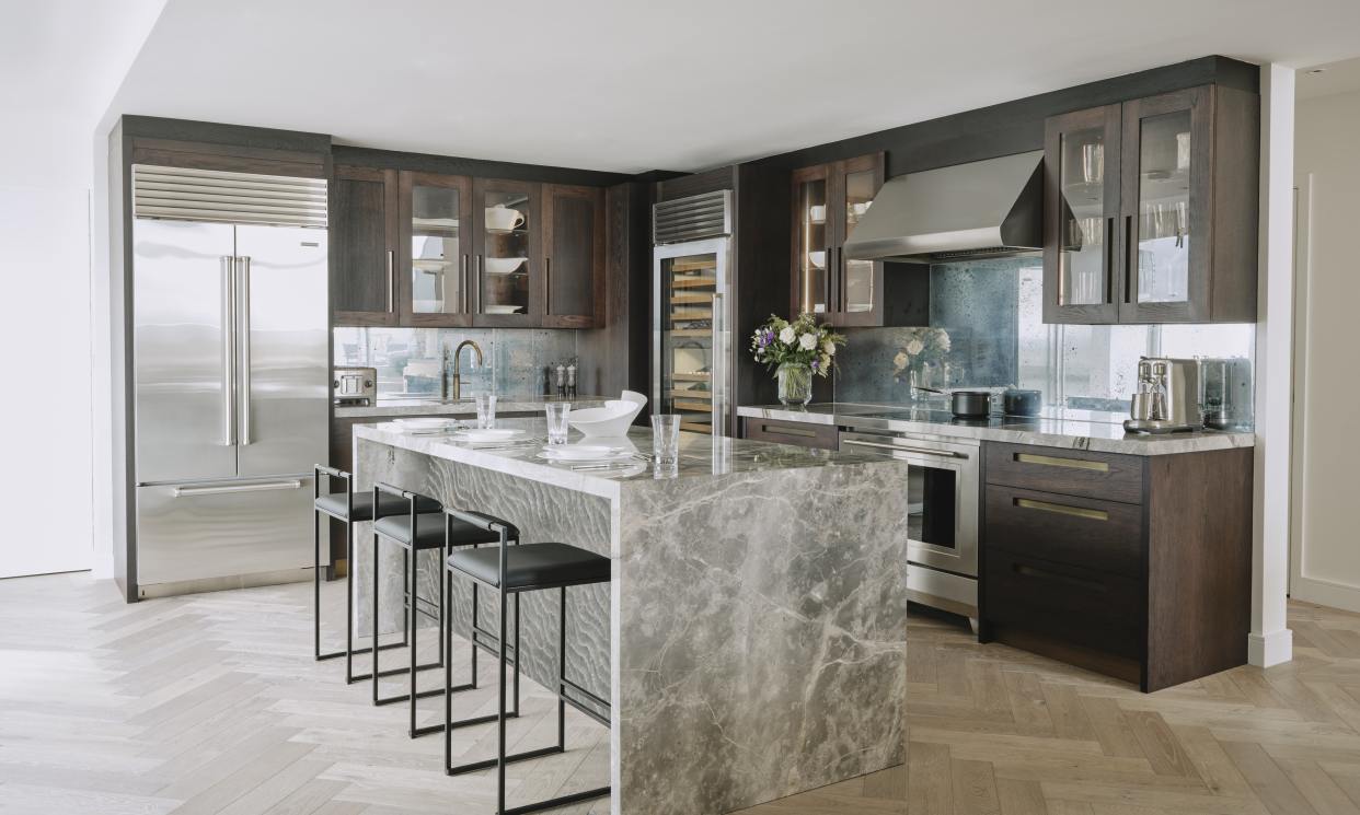 Canary Wharf Kitchen by Ledbury Studio featuring quartz island and dark stained oak